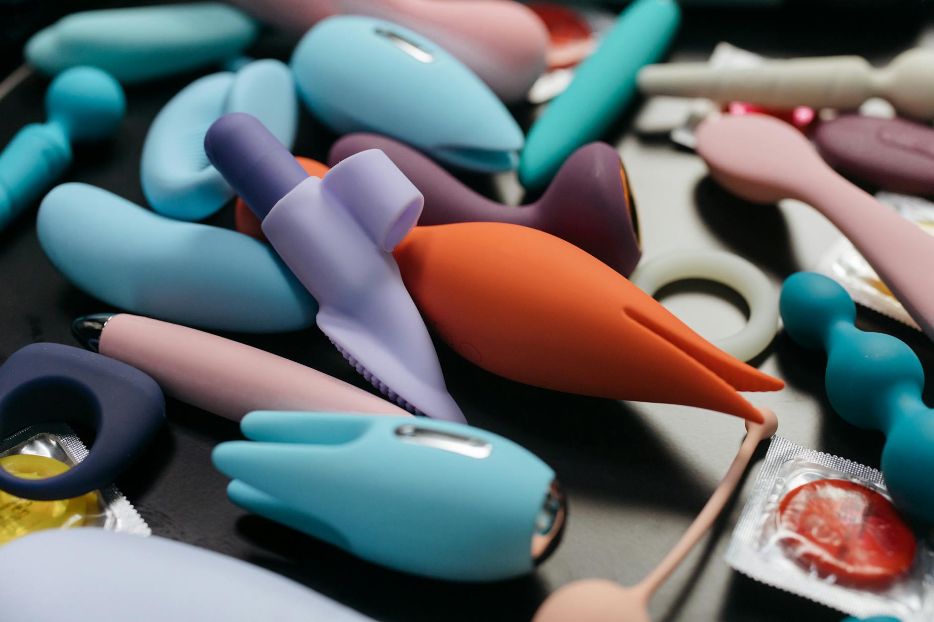 An array of colorful vibrators including the Lem in different lighting, showcasing design and intimate options